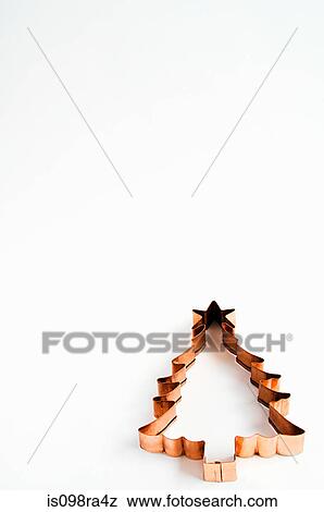 Christmas tree shaped cookie cutter View Large Photo Image Stock Photo - Christmas tree shaped cookie cutter. Fotosearch