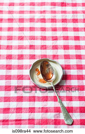 Picture - Jam on a spoon. Fotosearch