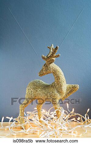 Reindeer decoration and christmas lights View Large Photo Image Stock Image - Reindeer decoration and christmas lights. Fotosearch
