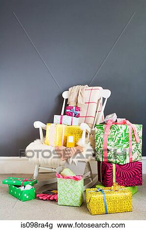 Rocking chair and gifts View Large Photo Image Stock Image - Rocking chair and gifts. Fotosearch