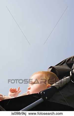 Baby in push chair View Large Photo Image Stock Image - Baby in push chair. Fotosearch