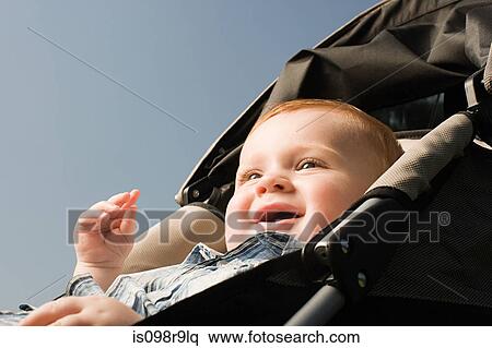 Stock Photography - Baby in push chair. Fotosearch
