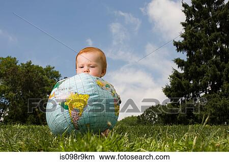 Baby with inflatable globe View Large Photo Image Picture - Baby with inflatable globe. Fotosearch