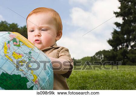 Baby with inflatable globe View Large Photo Image Stock Image - Baby with inflatable globe. Fotosearch