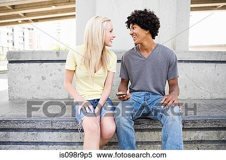 Stock Photography - Teenage couple face to face. Fotosearch