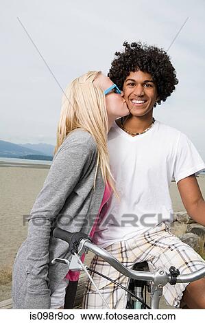 Teenage couple with bicycle View Large Photo Image Picture - Teenage couple with bicycle. Fotosearch