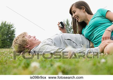 Teenage couple with digital camera View Large Photo Image Stock Photo - Teenage couple with digital camera. Fotosearch