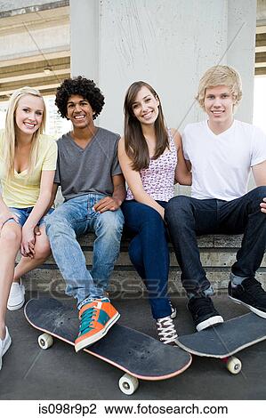 Teenage friends with skateboards View Large Photo Image Stock Image - Teenage friends with skateboards. Fotosearch