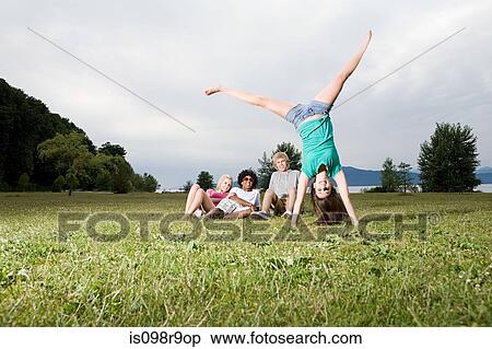 Teenage girl going handstand View Large Photo Image Stock Photography - Teenage girl going handstand. Fotosearch