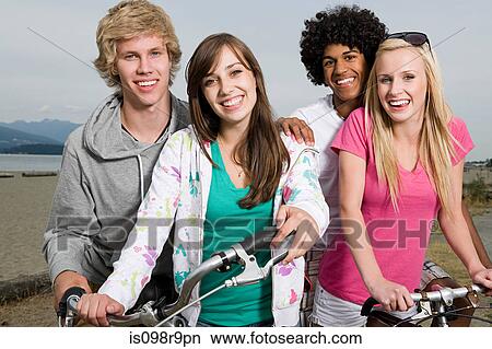 Picture - Teenagers with bicycles. Fotosearch