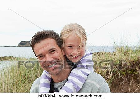 Father and daughter at the coast View Large Photo Image Stock Image - Father and daughter at the coast. Fotosearch