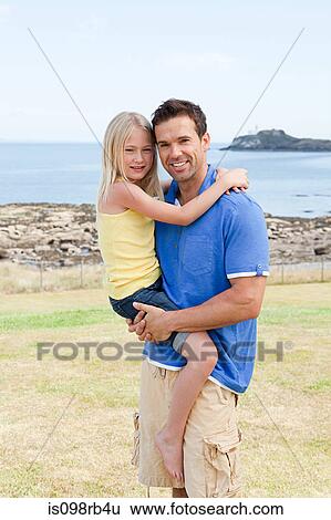 Father and daughter at the coast View Large Photo Image Stock Photograph - Father and daughter at the coast. Fotosearch