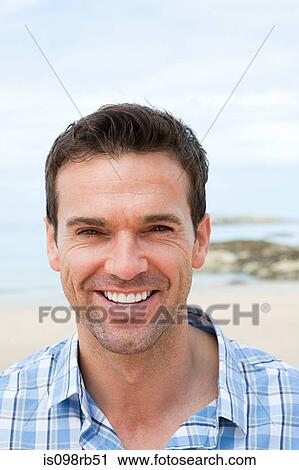 Man at the coast View Large Photo Image Stock Image - Man at the coast. Fotosearch