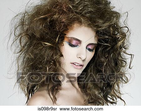 Young woman with curly hair View Large Photo Image Stock Photography - Young woman with curly hair. Fotosearch