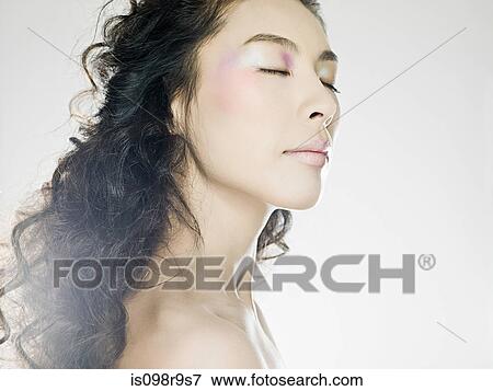 Young woman with eyes closed View Large Photo Image Stock Photo - Young woman with eyes closed. Fotosearch