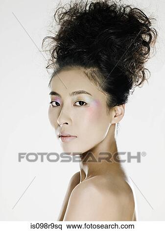 Stock Photography - Young woman with hair up. Fotosearch