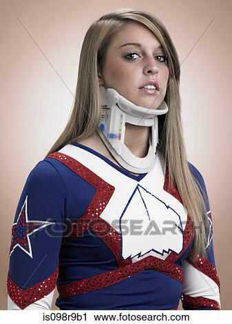 Stock Image - Cheerleader wearing a neck brace. Fotosearch