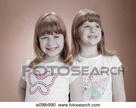 Identical twin girls View Large Photo Image Stock Image - Identical twin girls. Fotosearch