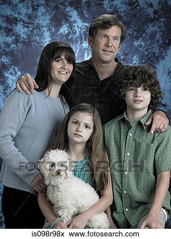 Portrait of a family with poodle View Large Photo Image Stock Photo - Portrait of a family with poodle. Fotosearch
