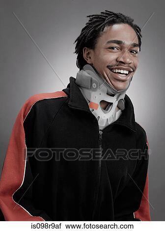 Portrait of a teenage boy in neck collar View Large Photo Image Stock Image - Portrait of a teenage boy in neck collar. Fotosearch