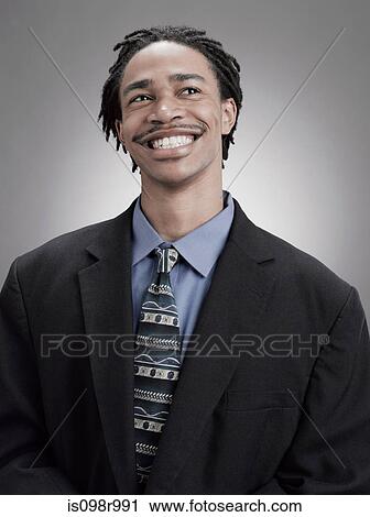 Smiling teenage boy wearing suit View Large Photo Image Stock Image - Smiling teenage boy wearing suit. Fotosearch