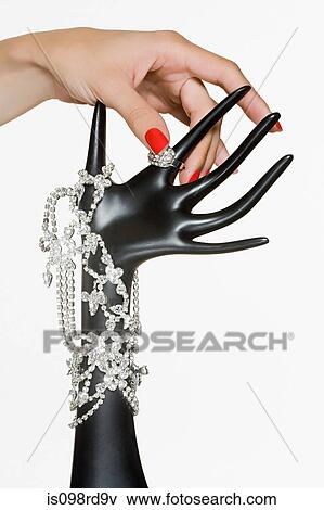 Female and and jewelry on stand View Large Photo Image Stock Photo - Female and and jewelry on stand. Fotosearch