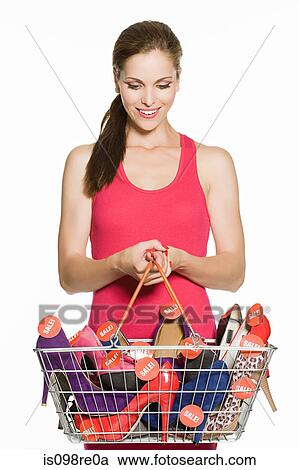 Woman with basket full of sale shoes View Large Photo Image Stock Image - Woman with basket full of sale shoes. Fotosearch