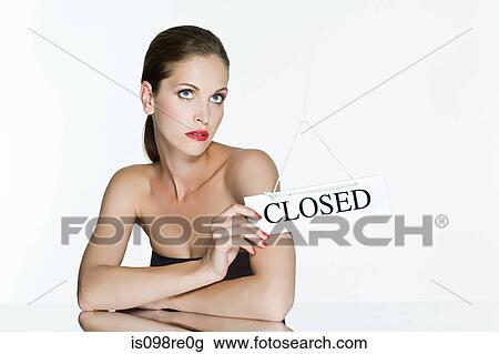 Young woman with closed sign View Large Photo Image Stock Image - Young woman with closed sign. Fotosearch