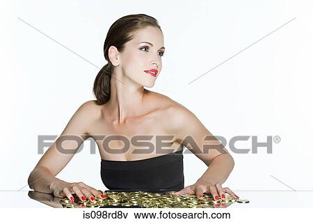 Stock Photo - Young woman with coins. Fotosearch