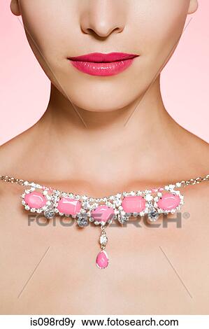Young woman with necklace View Large Photo Image Stock Photo - Young woman with necklace. Fotosearch