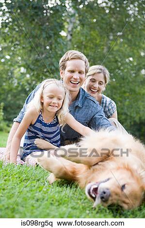 Family in the park with golden retriever View Large Photo Image Stock Photography - Family in the park with golden retriever. Fotosearch