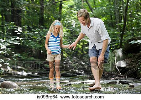 Father and daughter in river View Large Photo Image Picture - Father and daughter in river. Fotosearch
