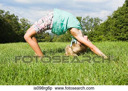 Stock Image of Girl bending over backwards is098rg6p - Search Stock ...