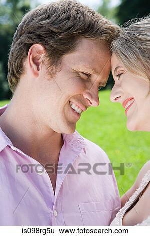Loving couple outdoors View Large Photo Image Stock Photograph - Loving couple outdoors. Fotosearch