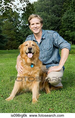 Man with golden retriever View Large Photo Image Stock Image - Man with golden retriever. Fotosearch
