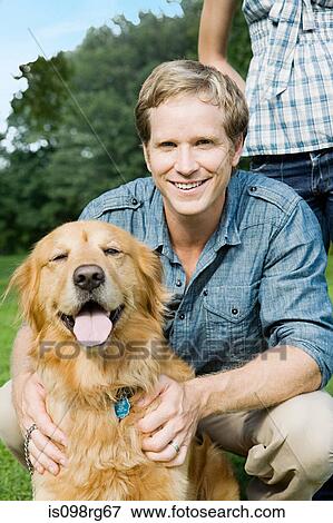 Man with golden retriever View Large Photo Image Stock Photo - Man with golden retriever. Fotosearch