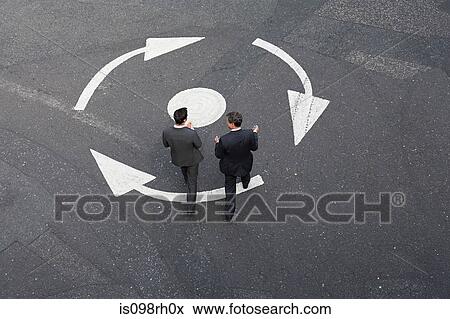 Stock Photo - Businessmen crossing the road. Fotosearch