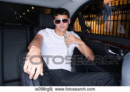 Cool man in the back of a car View Large Photo Image Stock Image - Cool man in the back of a car. Fotosearch