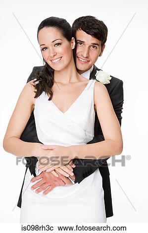 Bride and groom hugging View Large Photo Image Stock Image - Bride and groom hugging. Fotosearch