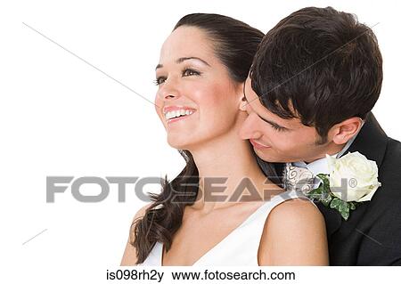 Bride and groom hugging View Large Photo Image Stock Photo - Bride and groom hugging. Fotosearch
