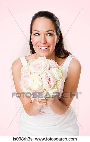 Bride holding a bouquet View Large Photo Image Stock Photograph - Bride holding a bouquet. Fotosearch