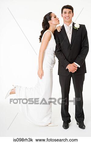 Bride kissing the groom View Large Photo Image Stock Image - Bride kissing the groom. Fotosearch