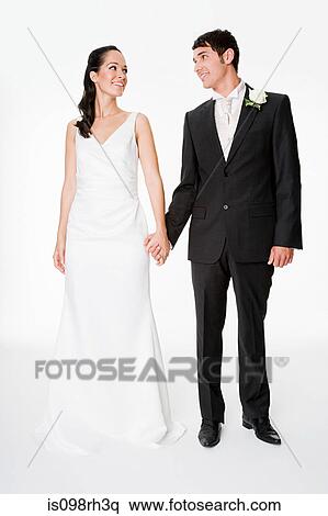 Newlywed couple holding hands View Large Photo Image Stock Photography - Newlywed couple holding hands. Fotosearch