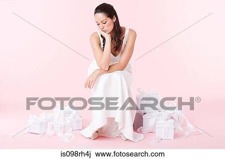 Sad bride looking at wedding gifts View Large Photo Image Stock Image - Sad bride looking at wedding gifts. Fotosearch