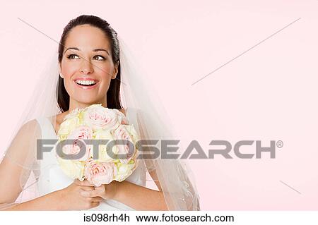 Smiling bride holding a bouquet View Large Photo Image Stock Image - Smiling bride holding a bouquet. Fotosearch