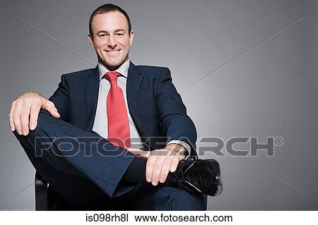 Stock Image - Smiling businessman. Fotosearch