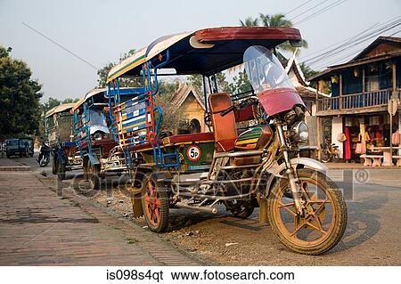 Stock Photograph - Tuk tuks in luang prabang laos. Fotosearch