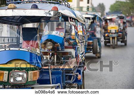Stock Photograph - Tuk tuks in luang prabang. Fotosearch