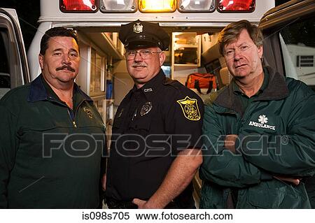 Stock Photography - Policeman and emergency medical technicians. Fotosearch