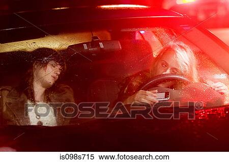 Stock Photography - Two young women in a car accident. Fotosearch